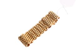 An 18ct gold wide bracelet.