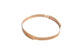 A child's 9ct gold adjustable christening bangle.