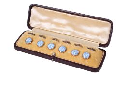 A 19th/20th century boxed set of six Willow Pattern enamelled dress studs. Unmarked, with fixings.