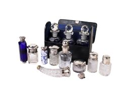 An assortment of Victorian and later scent bottles and jars.