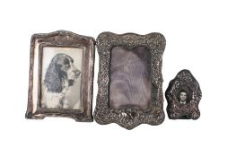 Three Victorian and later silver and white metal photograph frames.