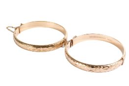 A 9ct gold bangle and a rolled gold example.