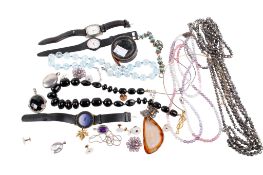 An assortment of costume jewellery and watches.