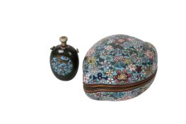 A Chinese cloisonne peach shaped box and a Japanese cloisonne snuff bottle.