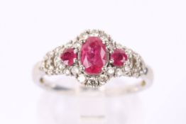 A 14ct gold, ruby and diamond dress ring by Kallati.