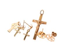 Four pieces of 9ct gold or yellow metal jewellery. Comprising a crucifix pendant, weight 3.