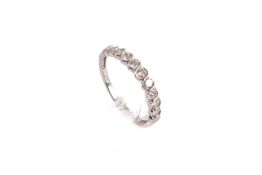 A 9ct white gold and diamond ring.