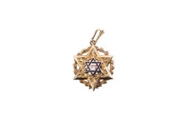A yellow metal and enamel Star of David pendant.