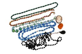 A small group of costume jewellery. Comprising a butterscotch amber brooch circa 3.3cm x 2.