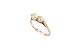 A 9ct gold (tested) double pearl ring. The largest pearl 5.