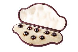 A set of eight yellow metal and red paste dress studs and links. Each diameter 1.