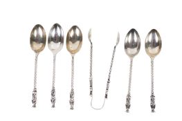 A set of five Edwardian silver apostle spoons and a pair of sugar tongs.