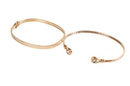 Two 9ct gold bangles.