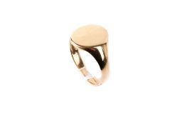 A 9ct gold signet ring. The face blank, hallmarked, size U, weight 5.7g.