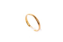 A 22ct gold wedding band. Size N, weight 2.0g.