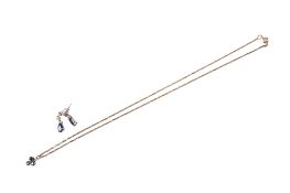 A pair of drop earrings and a sapphire pendant.