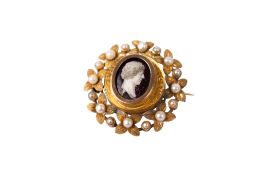 A 9ct gold (tested) brooch with a painted miniature of a bust in profile.