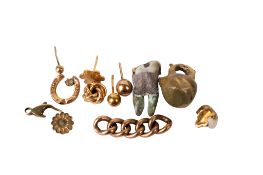 A small group of gold and yellow metal items.