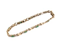 A gold and emerald fancy bracelet.
