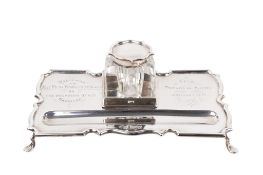 An early 20th century silver pen tray and inkwell.