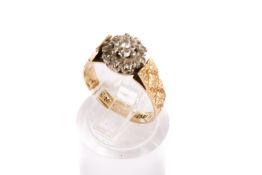 An 18ct gold (tested) and diamond dress ring. Set with round brilliant and single cut diamonds of 0.