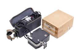 A Bolex MST 25 - 50 Motor and Type BX - 55.12 charger. Serial number P 1869.