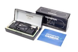 An Olympus XA 35mm Rangefinder camera. With an Olympus 35mm f2.8 F.