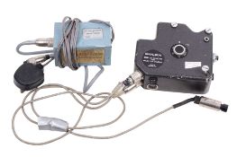A Bolex ESM 12V DC Motor for Bolex H16 cine cameras. Together with a Bolex H16 EBM battery charger.