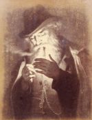 An Albumen photograph of Georg Hom's 'Smoking Man'. Framed and glazed. 27 x 32cm including frame.