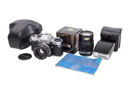 An Olympus OM10 35mm SLR camera outfit. Chrome. Serial number 2326312.