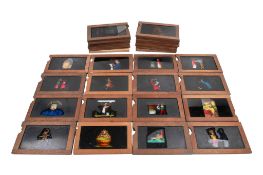 A collection of wood-framed hand-coloured single-slipper animated moving Magic Lantern Slides.