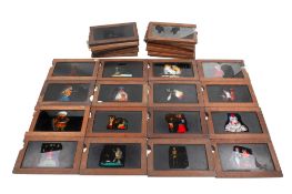 A collection of wood-framed hand-coloured single-slipper animated moving Magic Lantern Slides.