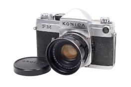 A Konica FM 35mm SLR camera. Chrome. Serial number 3804705. With a Konishiroku 52mm f1.
