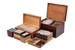 A collection of photographic glass plate negatives.
