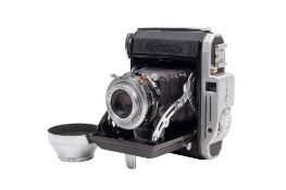 A Konishiroku Pearl 6 x 4.5 Medium Format Folding Rangefinder camera. With a Konishiroku 75mm f4.