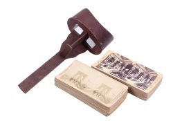 A stereoscopic viewer and a collection of viewing cards.