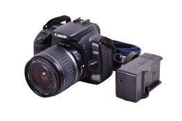 A Canon EOS 400D Digital SLR camera. With a Canon EF-S 18-55mm f3.5-5.6 II lens, optics VG.