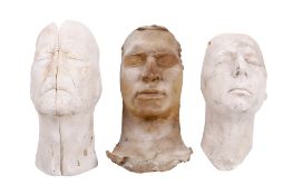 Christopher Tucker (1941-2022). Three plaster cast faces. One marked 'Derry Jordan' to the back.