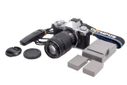 An Olympus OM-D E-M5II Mirrorless Digital camera. Powers on, shutter working.
