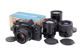 A Praktica BX20 35mm SLR camera outfit. With four lenses; a Vivitar 28mm f1.