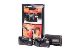 An Olympus AF-10 battery-powered moving cardboard countertop advertising display.