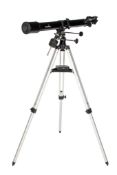 A Sky-Watcher 70/700 telescope on stand. Together with a Beck London eyepiece.