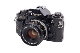 A Canon A-1 35mm SLR camera. Black. Serial number 1468968. Shutter working. With a Canon FD 50mm f1.