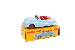 A Dinky No.106 diecast Austin Atlantic Convertible. Blue body with cerise interior and red hubs.