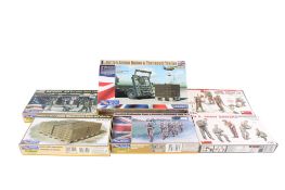 Six 1:35 scale military vehicle and figure model kits.