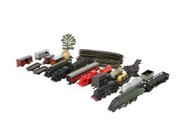 An assortment of 00 gauge locomotives, carriages and accessories.