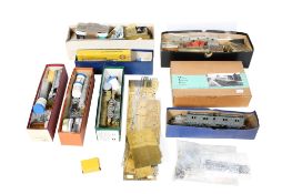 An assortment of partially constructed locomotives, carriages and components.