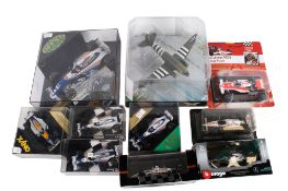 A collection of diecast racing cars and an Aviation Archive WWII Legends aircraft model.