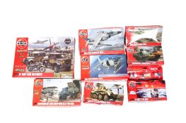 A collection of Airfix military vehicle plastic kits.