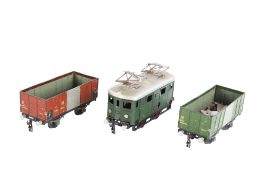A Swiss 0 gauge Buco Bucherer tinplate clockwork locomotive and two wagons.